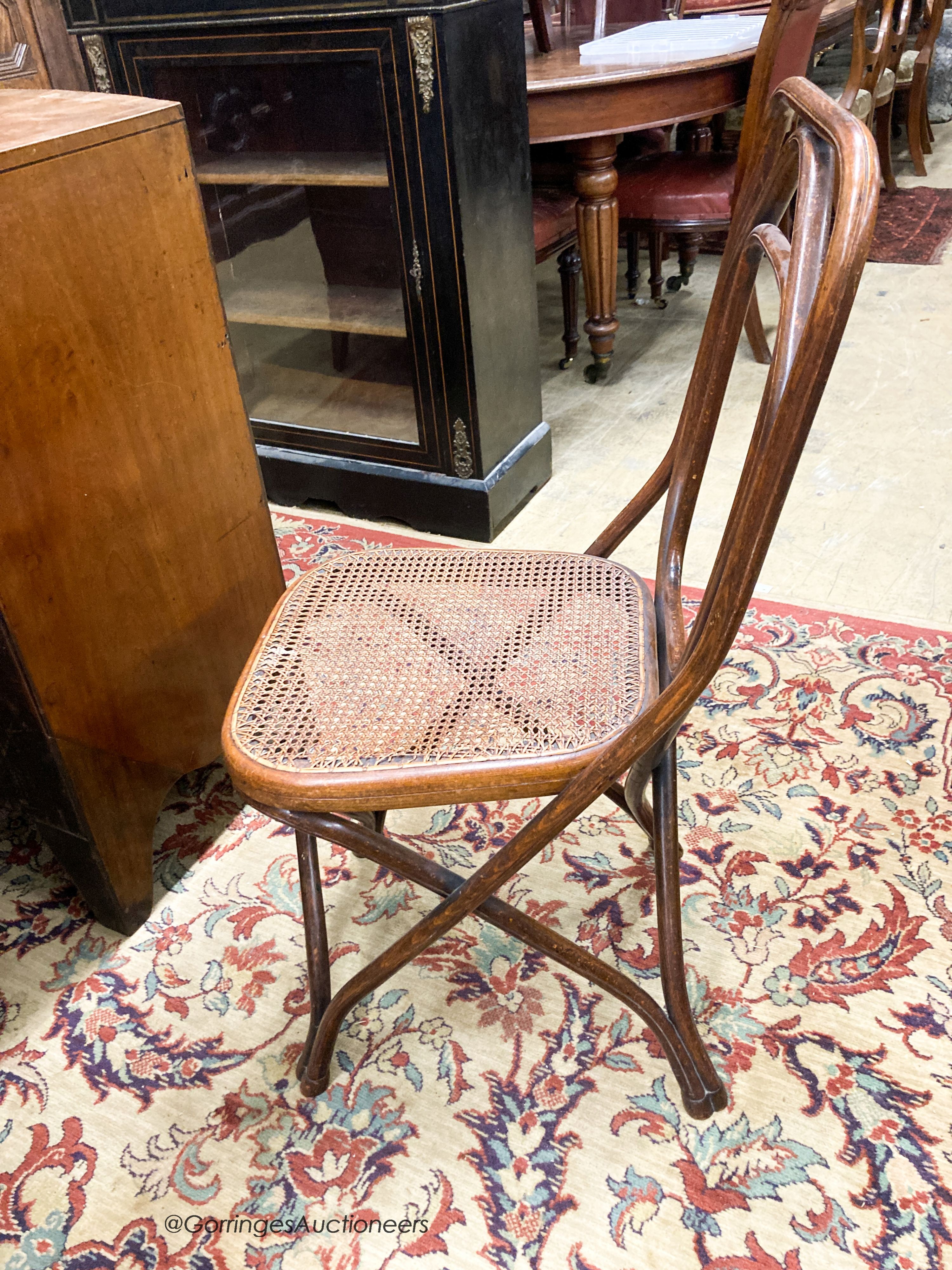 A set of five Thonet style caned beech bentwood chairs